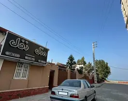 تابلوی ورودی هتل نخل در خیابان ساحلی